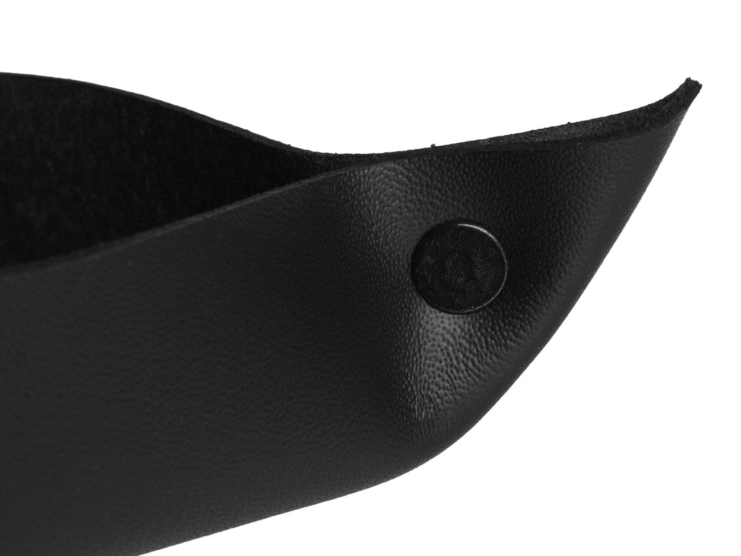 Close-up of the CarbonFG carbon fiber and leather valet tray corner detail, showing the quality stitching and rivet.