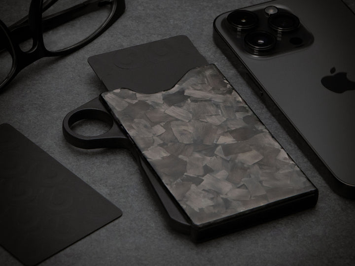 Grip6 forged carbon fiber wallet with loop on black background