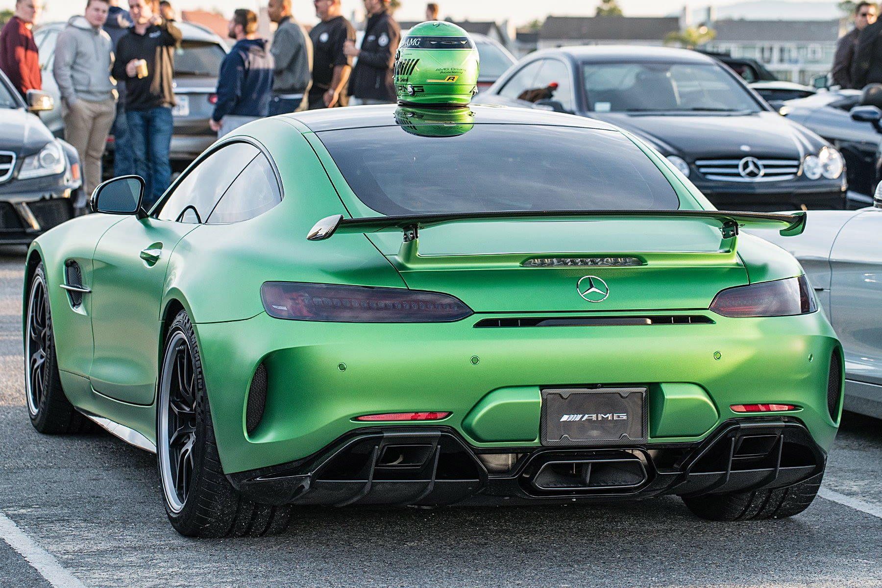Green Mercedes AMG GT with carbon fiber license plate frame