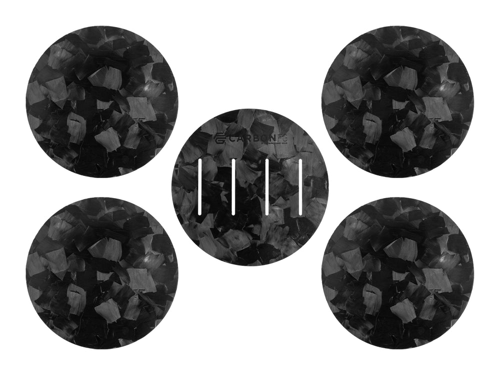 Four CarbonFG forged carbon fiber coasters and base with a distinct marbled design, exuding modern elegance and supercar-grade material.
