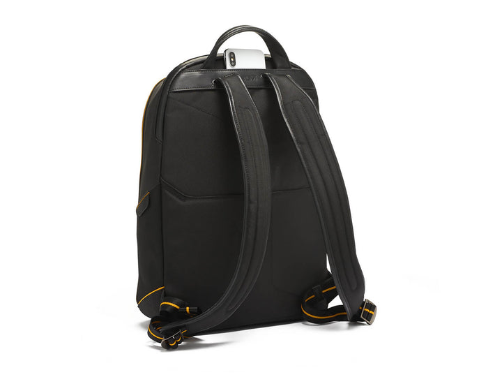 Back view of TUMI | McLaren Velocity Backpack, emphasizing ergonomic shoulder straps and McLaren Papaya detailing.