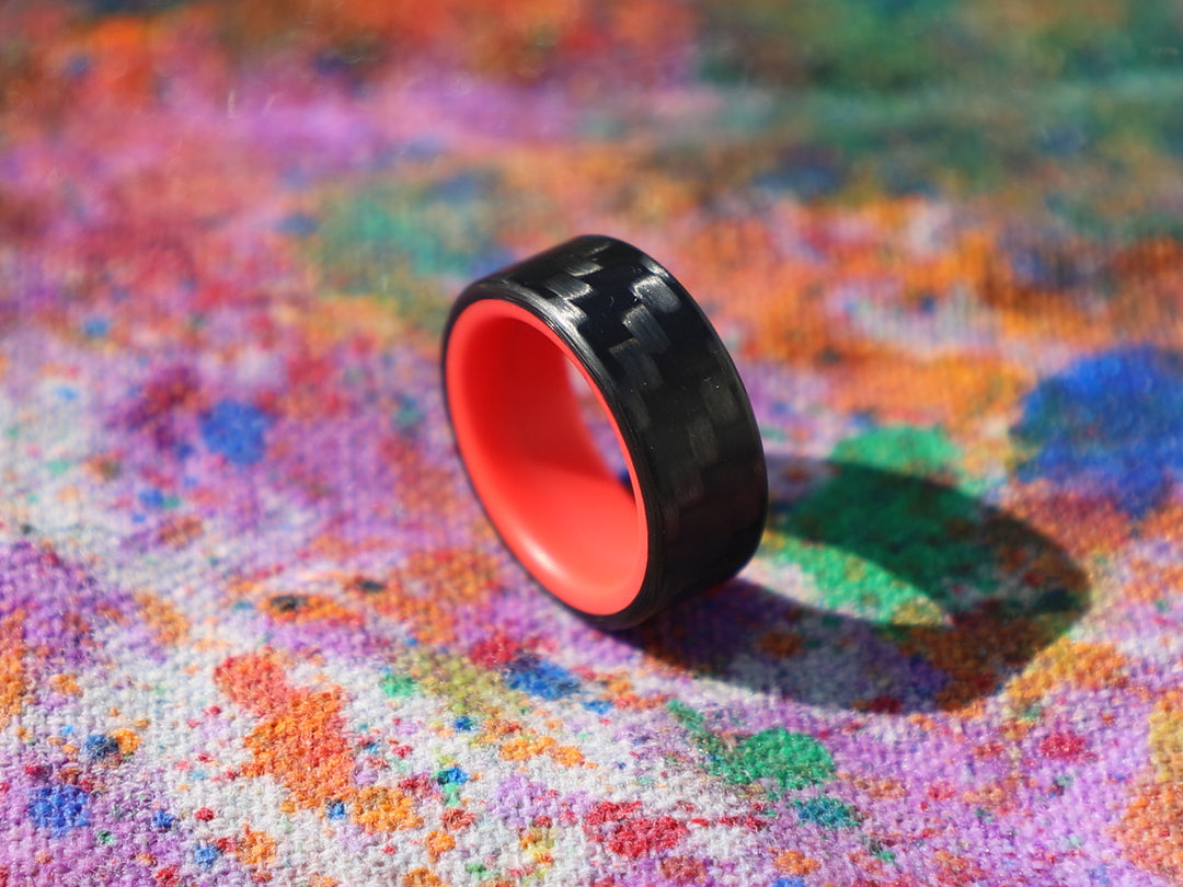 Red racer carbon fiber glow ring on painted canvas