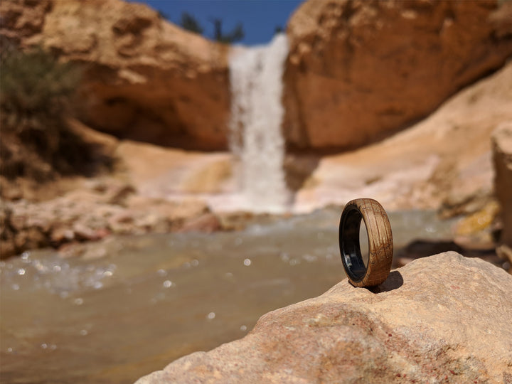 Distiller carbon fiber whiskey ring at waterfall