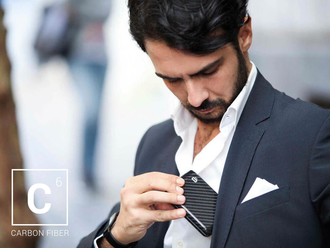 Ogon Smart Case V2 (formerly Stockholm V2) carbon fiber wallet being put in a pocket