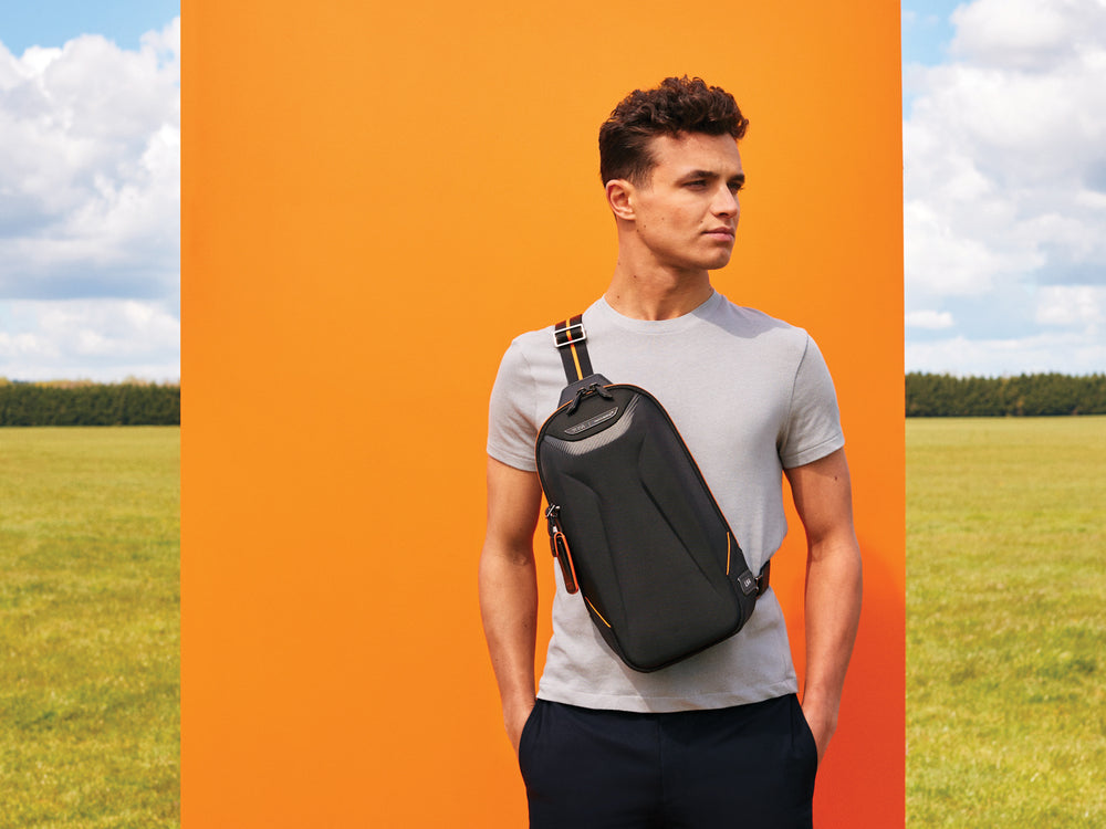 TUMI | McLaren Torque Sling on back#color_black-with-papaya