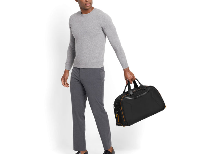 TUMI | McLaren Quantum Duffel being held