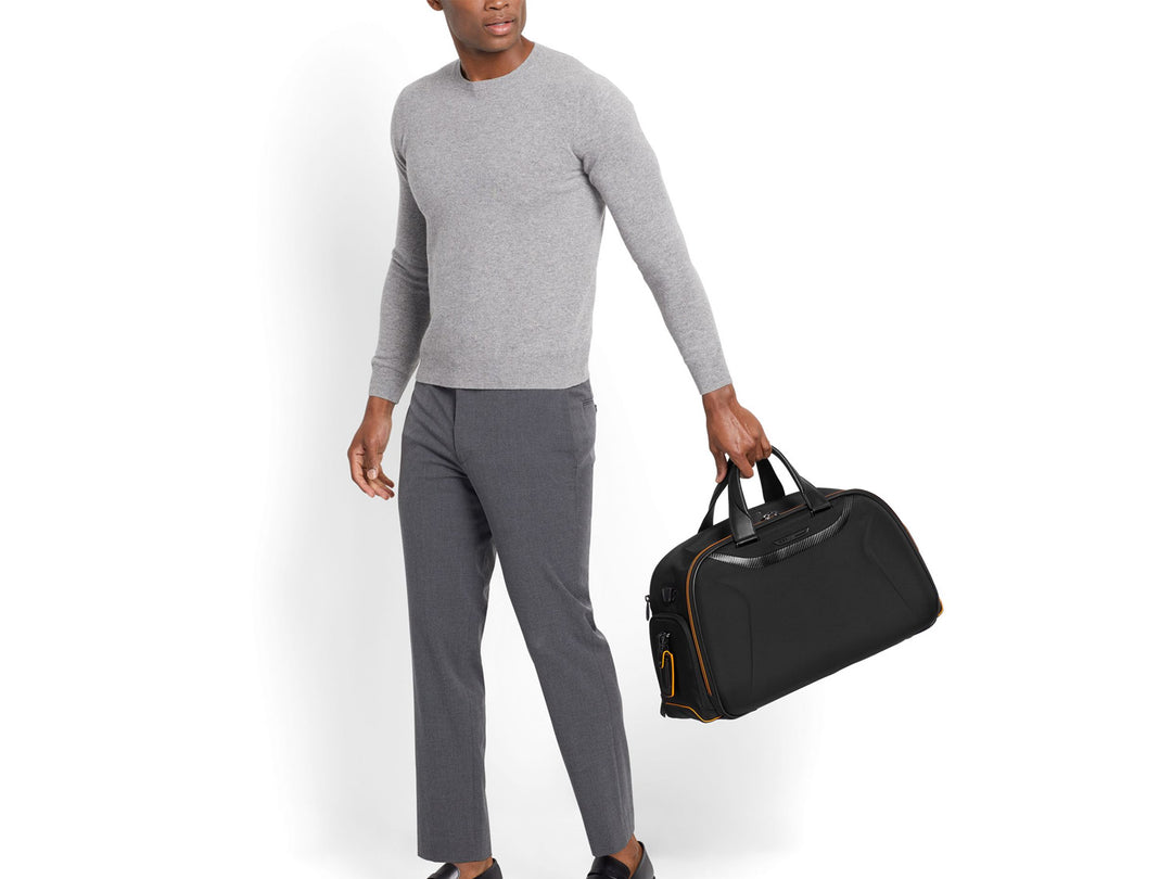 TUMI | McLaren Quantum Duffel being held